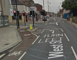 Good bit of segregation here to protect the cyclist, although I suspect most don't bother waiting. [Source: Google Streetview]